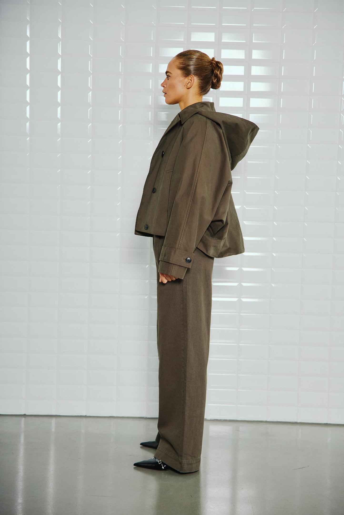 With Black Alaia in Midnight Green